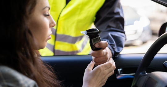 woman given a breathalyzer