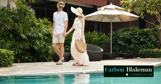 couple walking along the pool